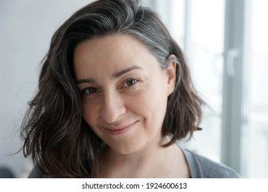 Portrait Of 38 Year Old Woman Against Home Office Background