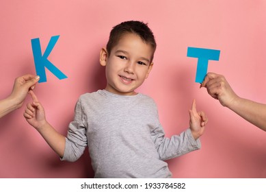 Portrait Of A 4 Year Old Boy  Speech Therapy Concept On Pink  Background. Correct Pronunciation And Articulation At Preschool Age.