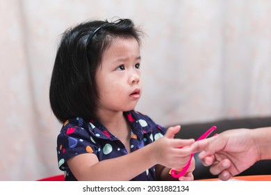 Portrait Of 4 Years Kid Holding Scissors Cutting Paper Tape Make Craft Activities Online Learning At Home. Kid Look Up At Mother Is Giving Instructions On How To Use Scissors. Creative Art Concept. 