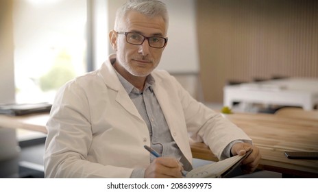 Portrait Of A 40 Year Old Doctor In His Office