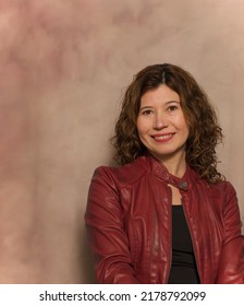 Portrait Of 40 Year Old Hispanic Woman, Short Curly Hair.