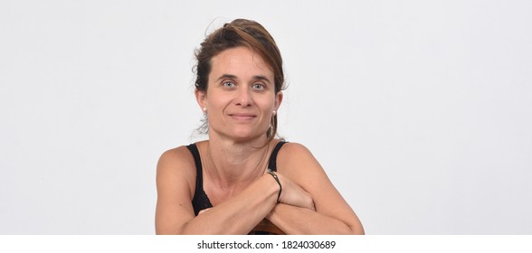 Portrait Of A 40 Year Old Woman Without Makeup On White Background, Front View,