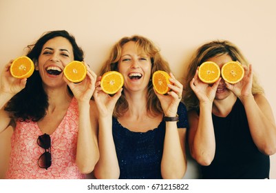 Portrait Of 40 Years Old Woman Holding Oranges