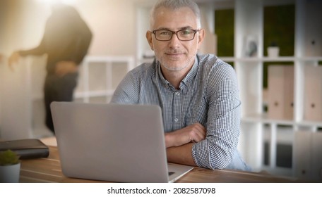 portrait of a 45-year-old businessman at work - Shutterstock ID 2082587098