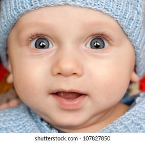 Portrait Of A 5 Month Old Baby Boy In Winter Hat