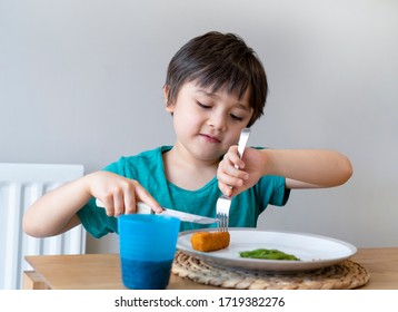 Portrait Of 5 Year Old Kid Boy Having Homemade Fish Finger And French Fries For Sunday Dinner At Home, A Happy Child Eating Lunch, Children Eating Heathy And Fresh Food, Healthy Life Style Concept