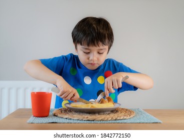 Portrait Of 5 Year Old Kid Boy Having Homemade Fish And Chips For Sunday Dinner At Home, A Happy Child Eating Lunch, Children Eating Heathy And Fresh Food, Healthy Life Style Concept