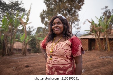 Portrait Of A 50 Year Old African Woman Well Dressed In An African Dress Outdoors