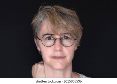 Portrait Of A 50 Year Old Woman With Glasses
