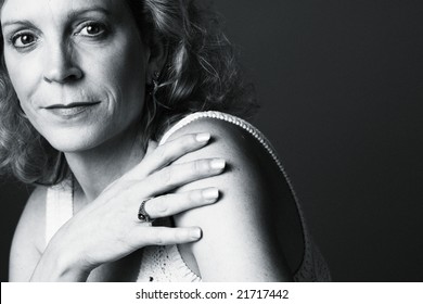 Portrait Of A 50 Year Old Woman On A Plain Background