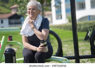 Portrait Of A 55 Year Old Senior Woman Doing Fitness In A Park