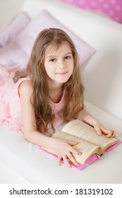 Portrait Of 6 Years Old Child Reading Book