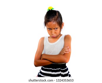 Portrait Of 8 Or 9 Years Old Sweet Sad And Upset Mixed Ethnicity Child Feeling Unhappy Posing Moody With Folded Arms Isolated On White Background In Young Girl Suffering Bullying At School