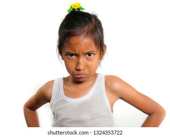 Portrait Of 8 Or 9 Years Old Sweet Sad And Upset Mixed Ethnicity Child Feeling Unhappy Posing Moody Isolated On White Background In Young Girl Suffering Bullying At School