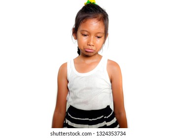 Portrait Of 8 Or 9 Years Old Sweet Sad And Upset Mixed Ethnicity Child Feeling Unhappy Posing Moody And Depressed Isolated On White Background In Young Girl Suffering Bullying At School