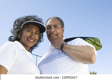 Portrait Of An Active Senior Couple On The Tennis Court