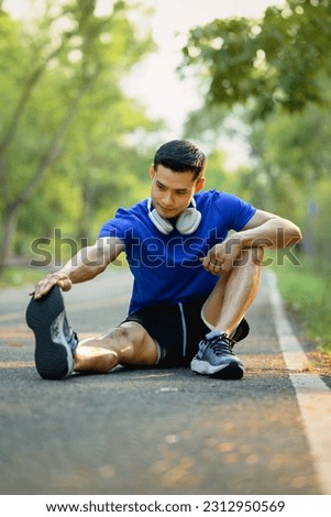 Similar – Jogger stretching in the morning on seaside.