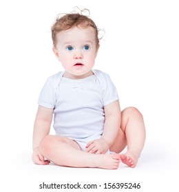 Portrait Of An Adorable Baby Girl With Beautiful Blue Eyes, On White Background