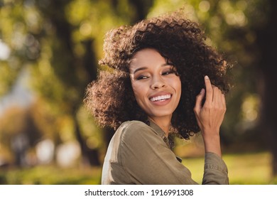 Portrait Of Adorable Dark Skin Person Hand Touching Curly Hairstyle Look Side Good Mood Enjoy Free Time Weekend Outdoors