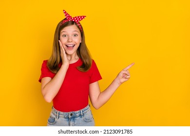 Portrait of adorable kind sweet little teen woman impressed face expression promote offer isolated on yellow color background - Powered by Shutterstock