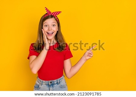 Portrait of adorable kind sweet little teen woman impressed face expression promote offer isolated on yellow color background