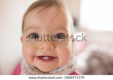 Portrait of adorable little girl. Cute smile face. Baby teething. First teeth.  