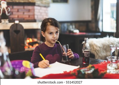 Portrait of adorable little girl having lunch at restaurant - Shutterstock ID 551452027