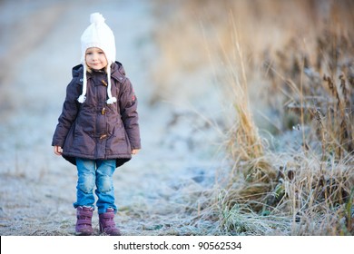 Portrait of adorable little girl outdoors on cold winter day