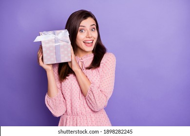 Portrait of adorable person hold giftbox near head guessing what inside wear vintage isolated on violet color background