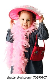 Portrait Of An Adorable Preschool Girl Playing Dress Up With A Fancy Hat, Purse, And Pearl Necklace Isolated On White