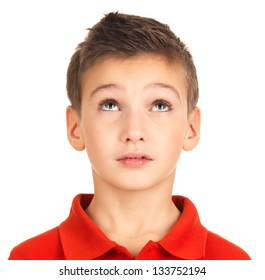 Portrait Of Adorable Young Boy Looking Up. Isolated On White