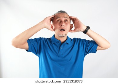 Portrait of Adult Asian Man showing stress expression. Suffering migraine.
 - Shutterstock ID 2311318373
