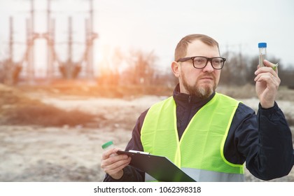 Portrait Adult Man The Ecologist. He Studies The Problems Of Ecology Arising From The Removal Of Construction Debris And Soil Contamination.