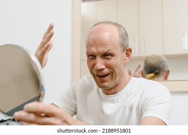 Portrait Of Adult Man Finished Self Haircut And Looking In Mirror On The Result