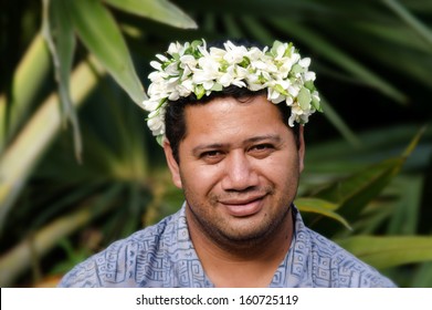 Portrait Of Adult Polynesian Pacific Island Tahitian Man Wearing Exotic Flowers Top Bouquet Smile Outside His Home Garden In Aitutaki Lagoon Cook Islands. Real People. Copy Space