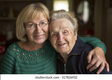 Portrait of an adult woman with his elderly mother.