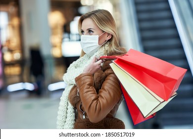 Portrait Of Adult Woman Shopping In Mall Wearing A Mask, Coronavirus Concept