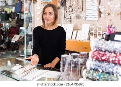 Portrait Of Adult Woman Worker Selling Bracelets In The Jewelry Store.