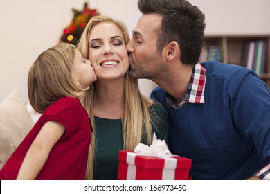 Portrait Of Affectionate Family In Christmas Time 