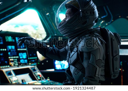 Portrait of African American Black male astronaut inside spaceship cockpit. Sci-fi space exploration concept. Mars mission