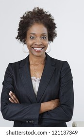 Portrait Of An African American Business Woman With Arms Crossed Isolated Over White Background