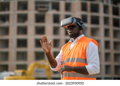 Portrait Of African American Engineer Using VR Gear To Visualize Projects On Construction Site