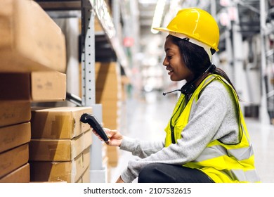 Portrait Of African American Engineer Woman Scanning Package With Barcode Scanner Check Goods In Transportation And Distribution In Warehouse.logistic Industrial And Business Export	