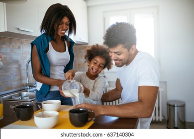 Portrait Of African American Family Enjoying Having Breakfast Together At Home.