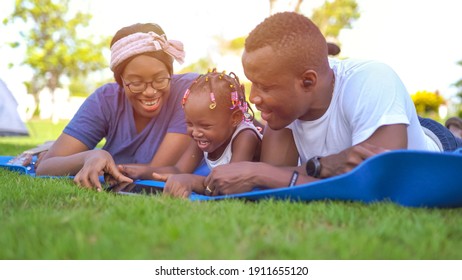 Portrait of an African American family looking very happy outdoors