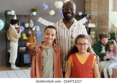 Portrait Of African American Family Of Three Smiling At Camera, Happy Father Posing With His Two Children At Birthday Party