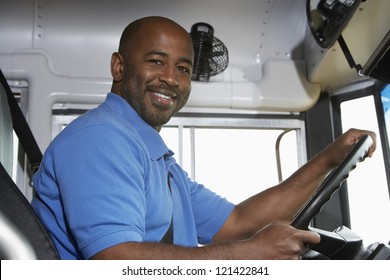 Portrait of an African American handsome bus driver smiling