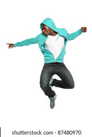 Portrait of African American hip hop dancer jumping isolated over white background