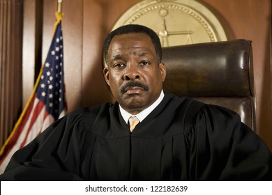 Portrait Of African American Judge Sitting In Courtroom