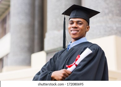 Portrait Of African American Male Graduate Standing Outside College